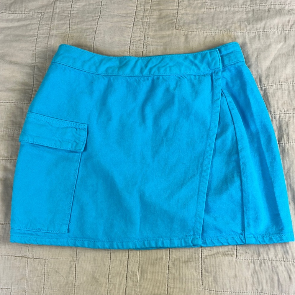 Bright blue denim mini skirt with wrap detail